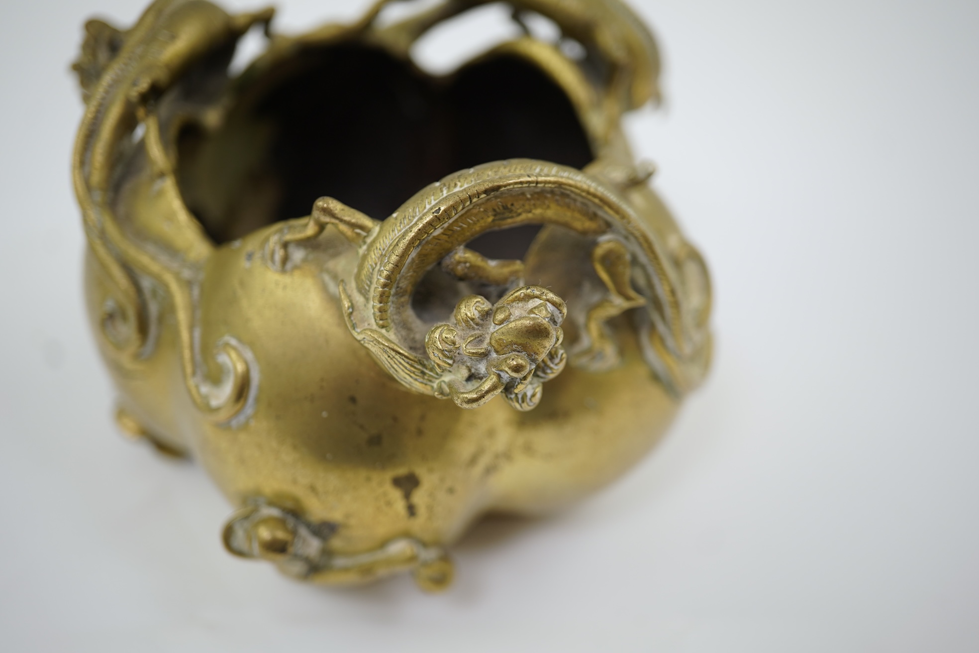 A large Chinese bronze rectangular censer and cover, Xuande seal mark, and a ‘plum blossom and chilong’ bronze censer, both 19th century